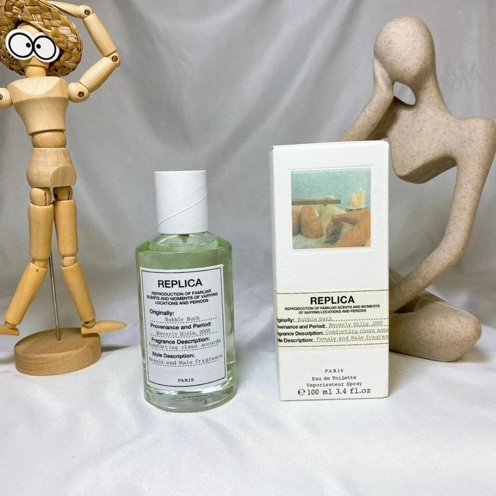 Theelegancejewellery 100ml Unisex Pheromone Perfume Long Lasting Woody Floral Natural Fragrance bottle with white cap next to wooden mannequin and replica box
